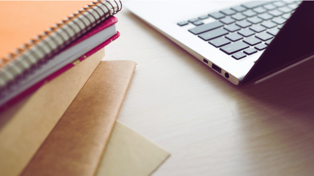 Easiest Online Bachelor Degree - featured image of laptop and notes
